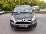 a small black van parked in a parking lot