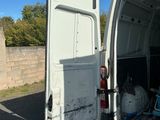 a white van that is open with the door open