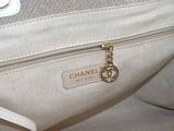 a white purse with a chain hanging from it ' s handle