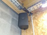 a speaker that is attached to a wall in a room