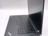 a laptop that is sitting on a white surface