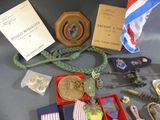 a table with a lot of medals and other items on it