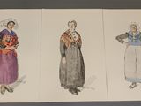 three drawings of asian women in traditional clothing are shown on a table