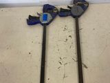 two tools that are laying on a table
