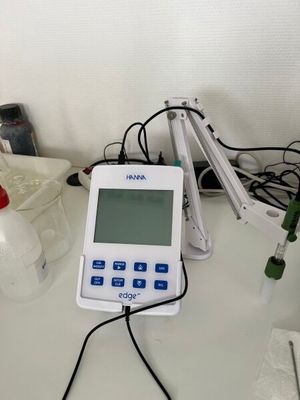 a white and blue electronic device sitting on a table