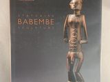 the cover of a book with a statue of a man holding a baby
