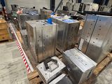 a large amount of metal boxes on a pallet in a warehouse