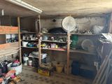 a room with a lot of items on the shelves