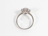 a close up of a diamond ring on a white surface