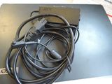 a laptop with a bunch of wires on top of it