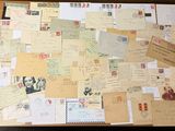 a suitcase full of letters and postcards sitting on the floor