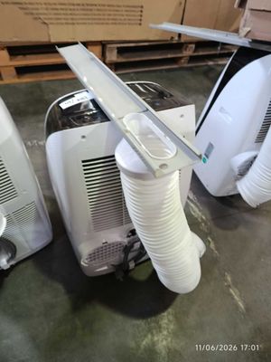 two air conditioners sitting on the floor next to each other