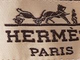 the label of a jacket with a picture of a horse on it