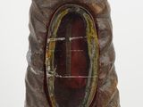 a sculpture of a tree trunk with a hole in it