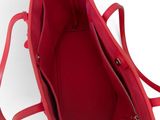 the inside of a red handbag with a zipper on it