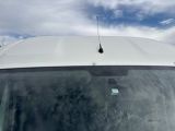 a white van that is parked in the parking lot