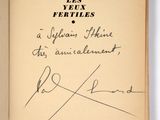 an open book with a handwritten title and signature on it