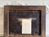 an old wooden box with a piece of paper in it
