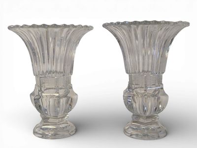 pair of clear glass vases on a white surface with a white background