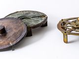 three different types of metal objects on a white surface
