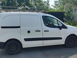 a white van that is parked on the side of the road
