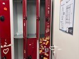 two red lockers in the hallway of a building