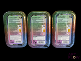 three plastic containers of food sitting on top of a black surface