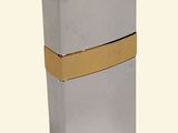silver lighter with a gold band on a white background