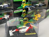 a lot of toy cars on display in a display case