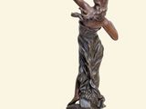 statue of a woman with a bow and arrow in her hand
