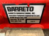 the back end of a red tractor with a label on it