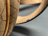 a close up of a bag with a handle on a table