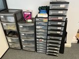 a lot of plastic drawers and bins in this room