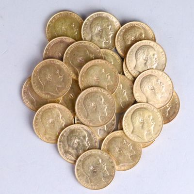 a pile of gold coins on a white surface