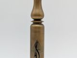 an antique brass pepper mill with a wooden base on a white background