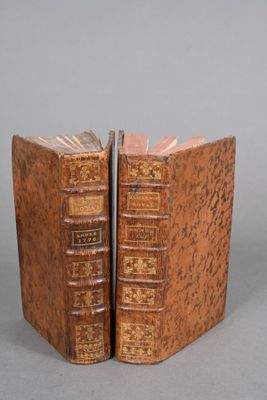 an old book shaped like a book with a bookmark on top of it