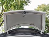 a trunk of a car with the roof open