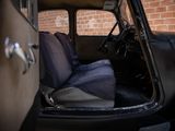 a black car with a blue seat cover sitting in the back of it