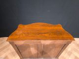 an old wooden cabinet sitting on top of a hard wood floor