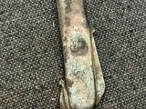 a close up of a piece of metal on a carpet