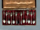 six silver spoons in a box with velvet lining
