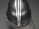a close up of a helmet on a black surface