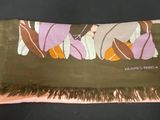 brown scarf with pink flowers and brown fringes on a black background