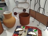 a table with vases, plates, and other items on it