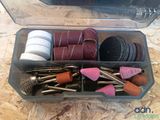 a plastic container filled with assorted tools on a table