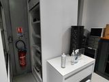 an image of a kitchen with a refrigerator and a microwave