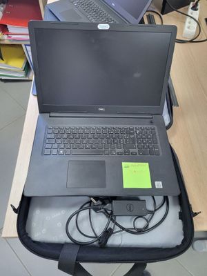 two laptops that are sitting in a bag on the table