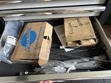 a drawer with a bunch of items inside of it