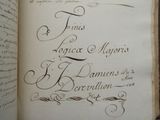 an old book with writing on it sitting on a table
