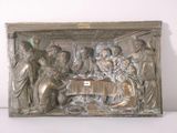 a metal sculpture of a group of people sitting at a table